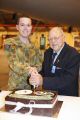 11 Squadron's 70th birthday cake cutting ceremony.The youngest member of 11 Squadron, Aircraftman Byron Cameron-Collins (left) and the President of the Catalina Club South Australia, Mr Art
Coppock cut the cake.