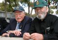 Clem Walters (left) and Don McCaran reminisce during the 70th anniversary of 10 and 11 Squadron celebrations held at Royal Australian Air Force Base Edinburgh.